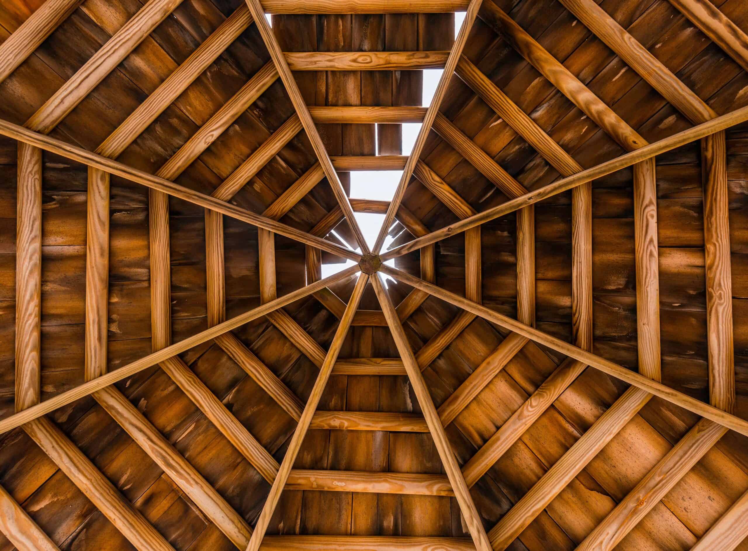 inside of a attic showing the wood of the roof