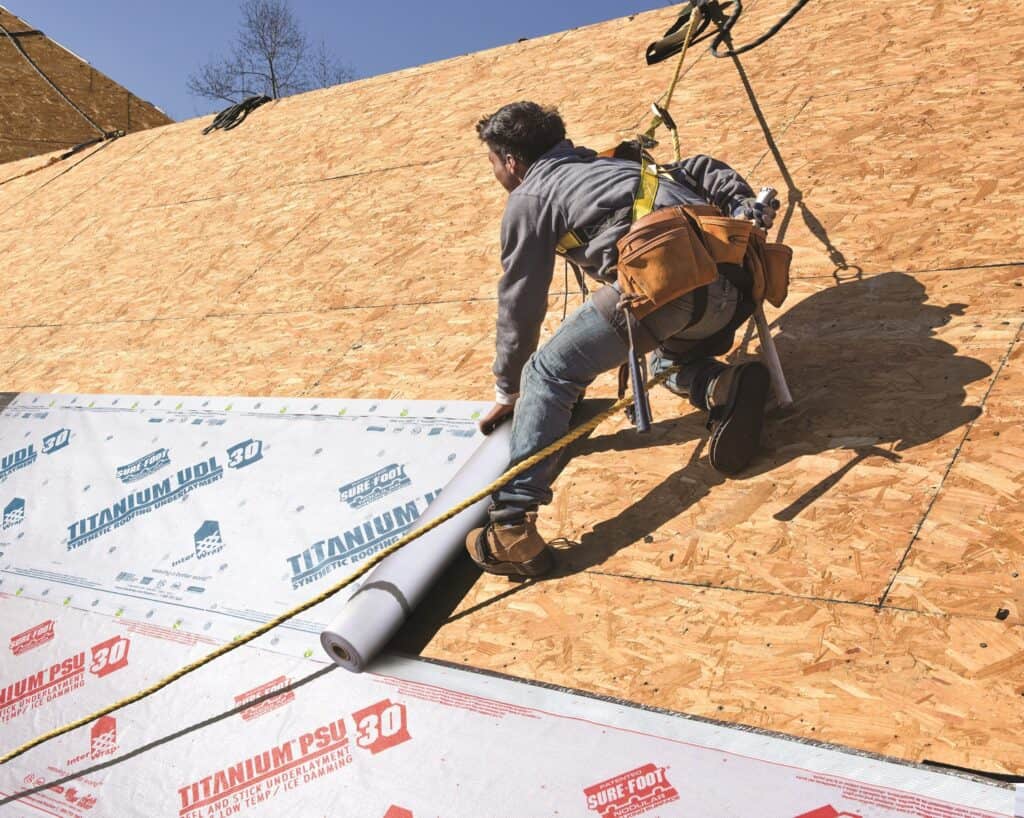 A professional Omaha roofer performing a roof installation.