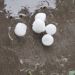 Five pieces of Hail on a patio chair cushion from Tuesday's Hail storm in Omaha