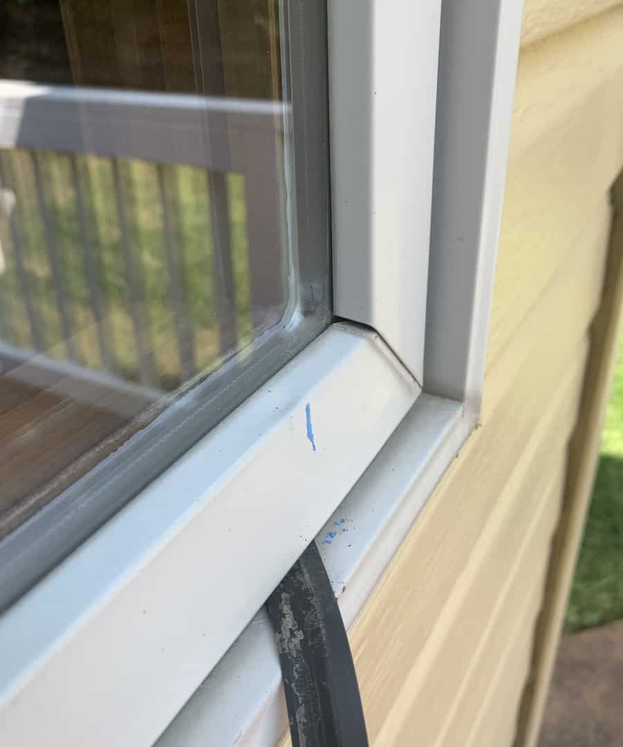 Window damage caused by Omaha hail storm, this window's seal was damaged by hail, it hangs below the window frame