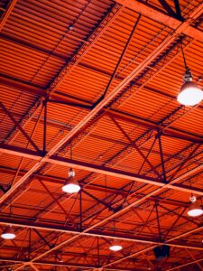 Interior Photo of red warehouse of commercial building with new roofing system