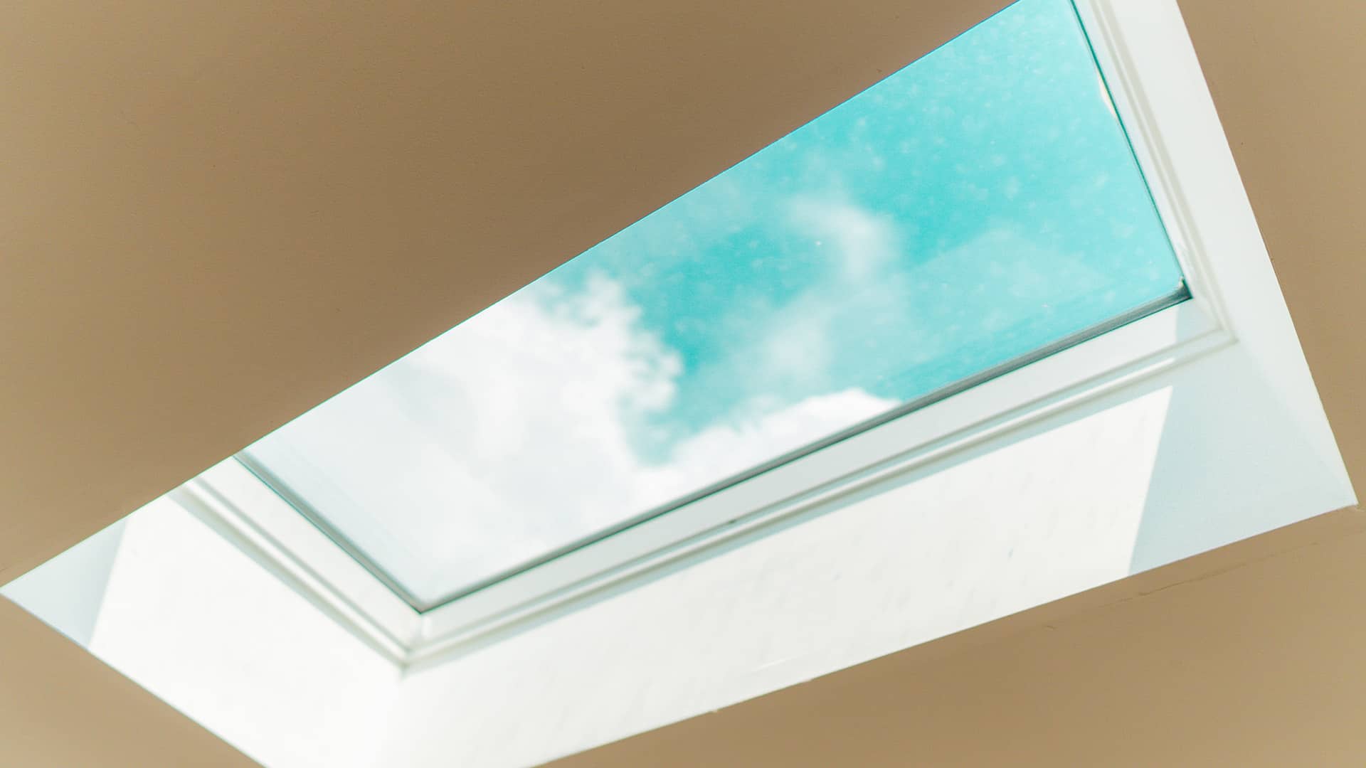 Cropped image of a skylight after a roof replacement on a Des Moines Home