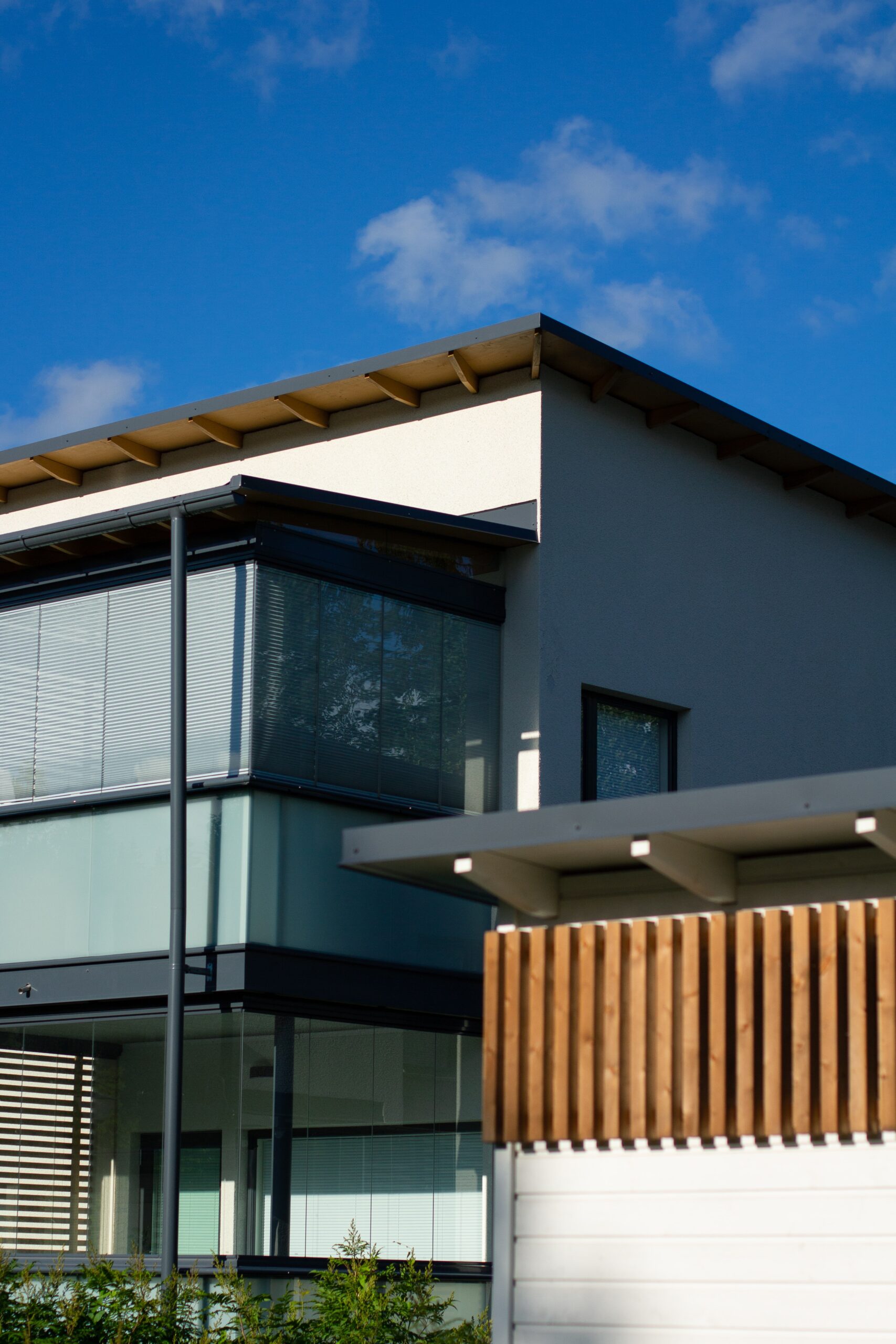 Omaha modern new construction home with light roof - after a flat roof installation