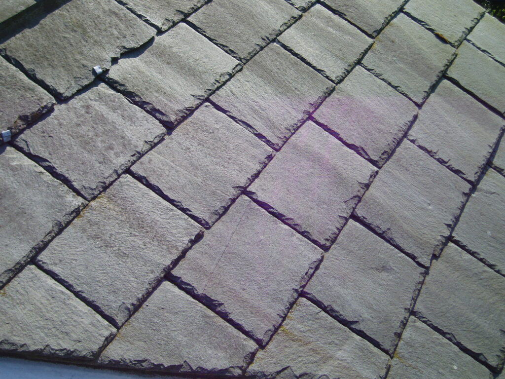 A closeup image of a slate roof on an Omaha roof.