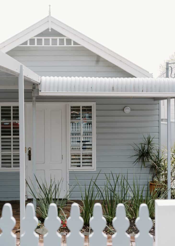 The front of an Omaha home with grey vinyl siding installed by a professional Omaha contractor.