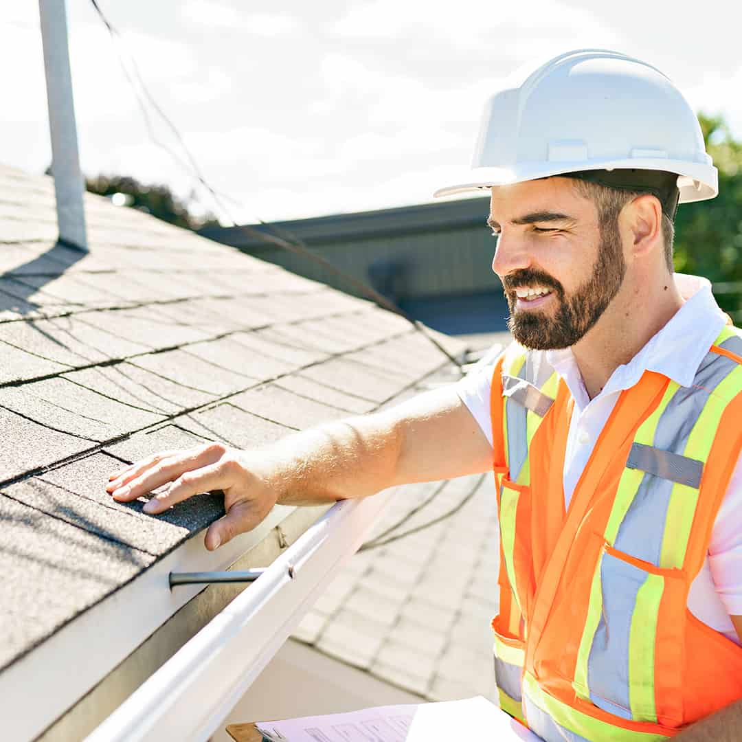 An Omaha roof contractor inspecting a roof.