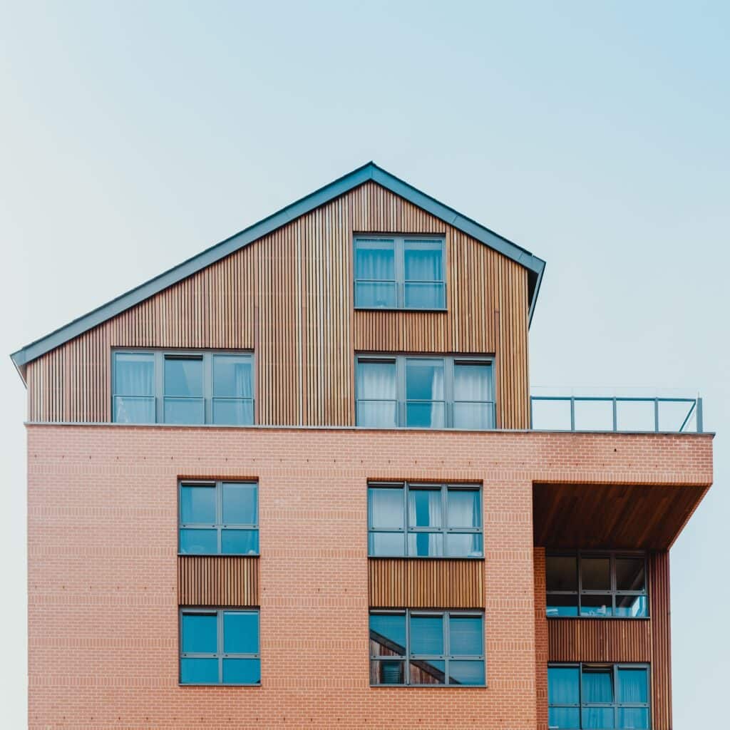 An orange building in Omaha with a section of composite wood siding.