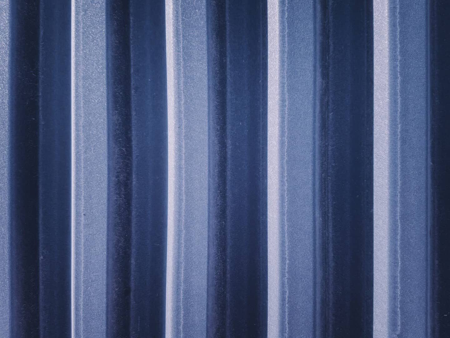A closeup image of a navy metal roof in Omaha.